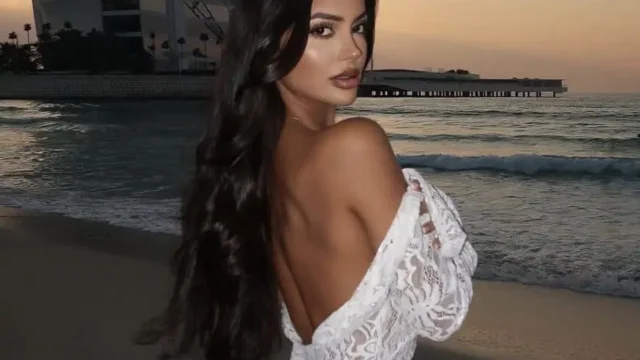 Hot Dubai Escort Model in palm jumeirah standing in front of Burj Al arab at Jumeirah Beach