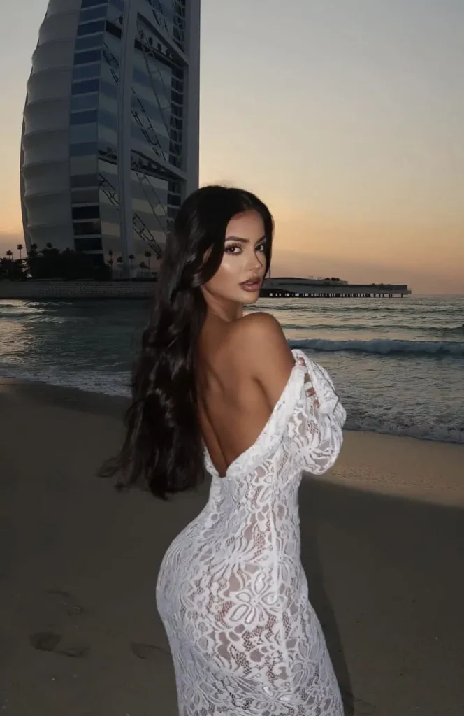 Hot Dubai Escort Model in palm jumeirah standing in front of Burj Al arab at Jumeirah Beach