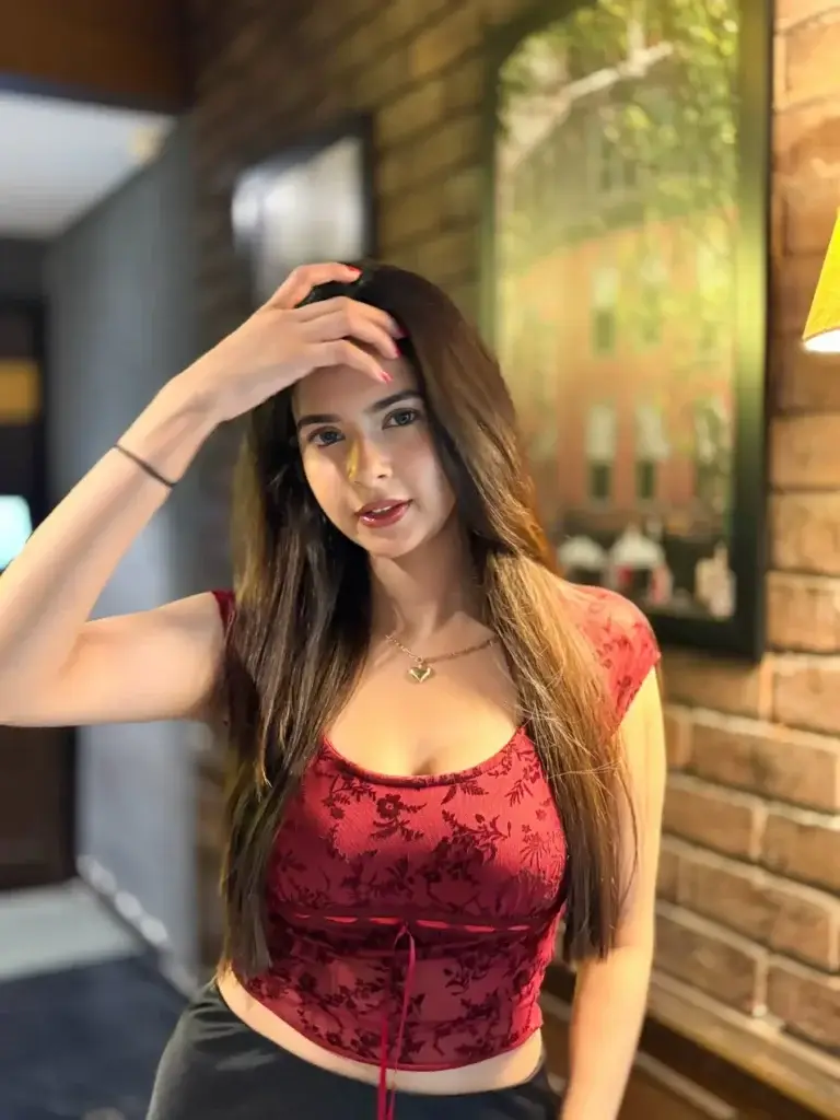 A beautiful close-up of Esha, the most breathtaking escort in Jumeirah Lakes Towers, giving a seductive and passionate smile.